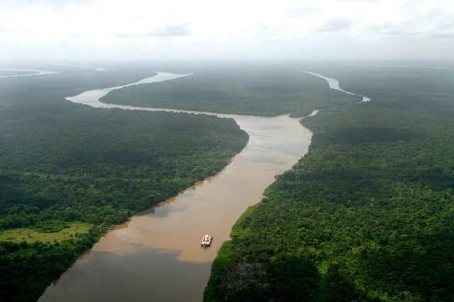 Aerial view of a freighter navigating on Amazon River.