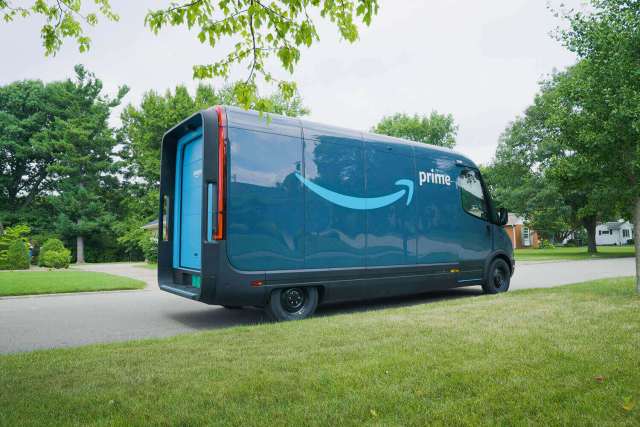 Back view of Amazon's new electric Rivian delivery trucks