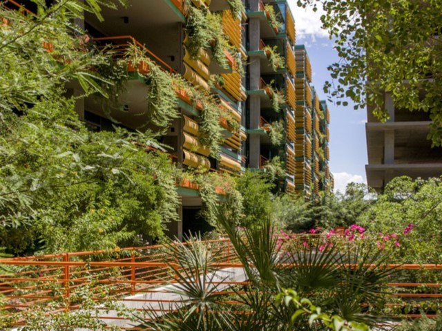 Plant-filled apartment complex in Optima Sonoran Village
