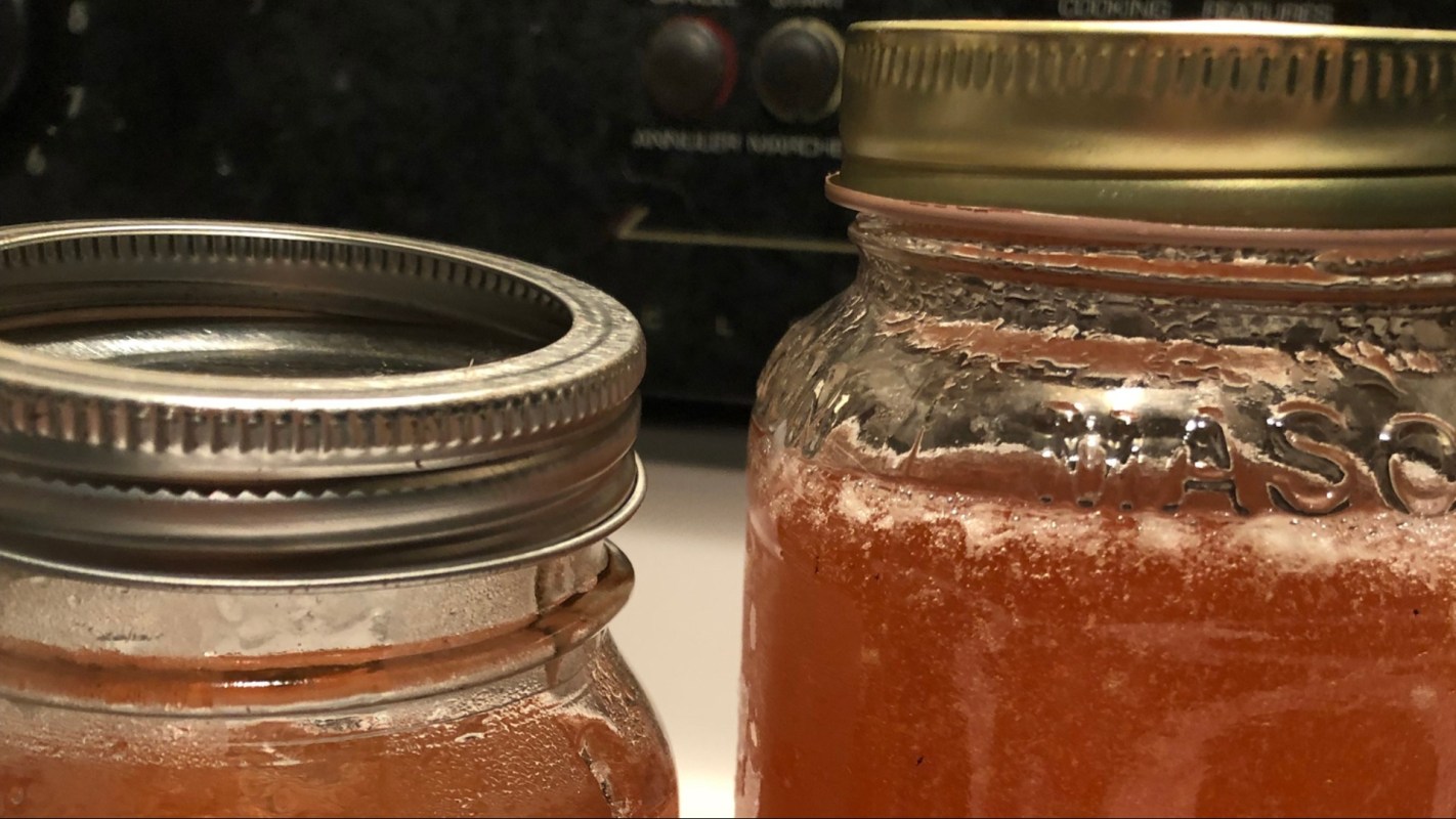 Making tea from leftovers in honey jar