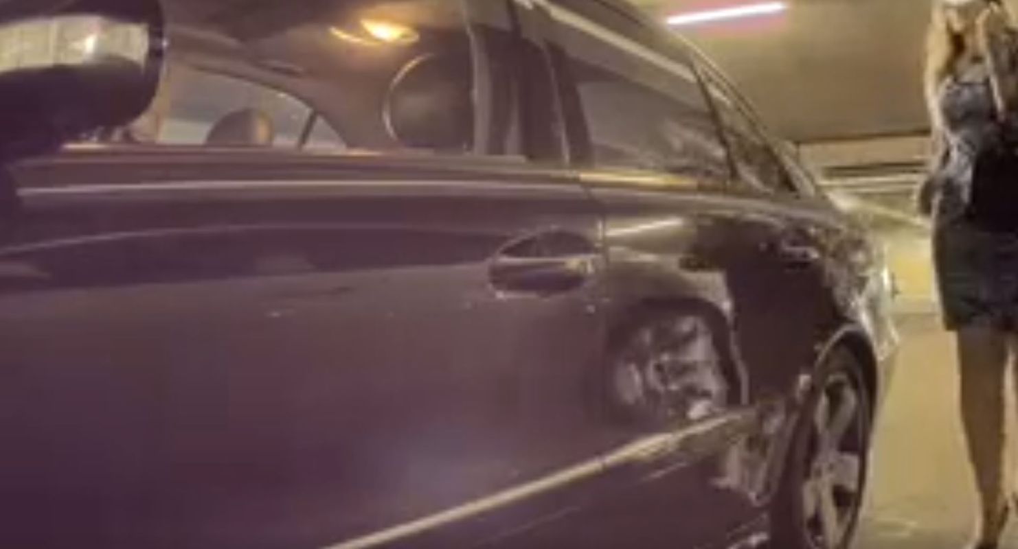 Dash cam footage showing woman intentionally keying Tesla car