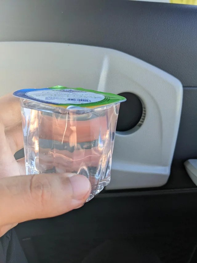 Single-use plastic water cup