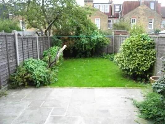 In the “before” image, the backyard is pleasant but nothing to write home about.