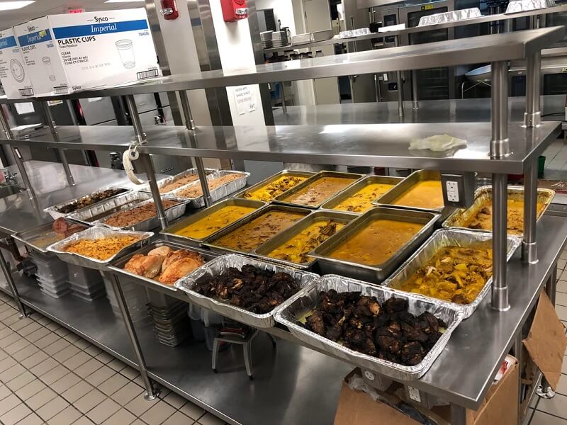 The photo showed 20 huge serving trays piled full of food, mostly entrées.