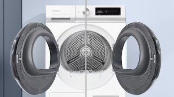 A clothes dryer with an open door.