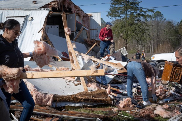 The severe weather knocked out power for hundreds of thousands of residents as high wind flipped cars while twister and flood warnings continued to accumulate.