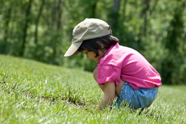 They have food in their hands, and a female voice encourages them to stay still.