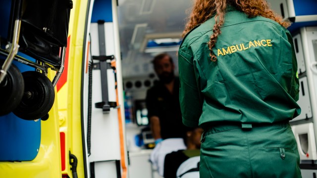 Surveillance videos show the animal clinging tightly to her leg as she struggles to dislodge it.