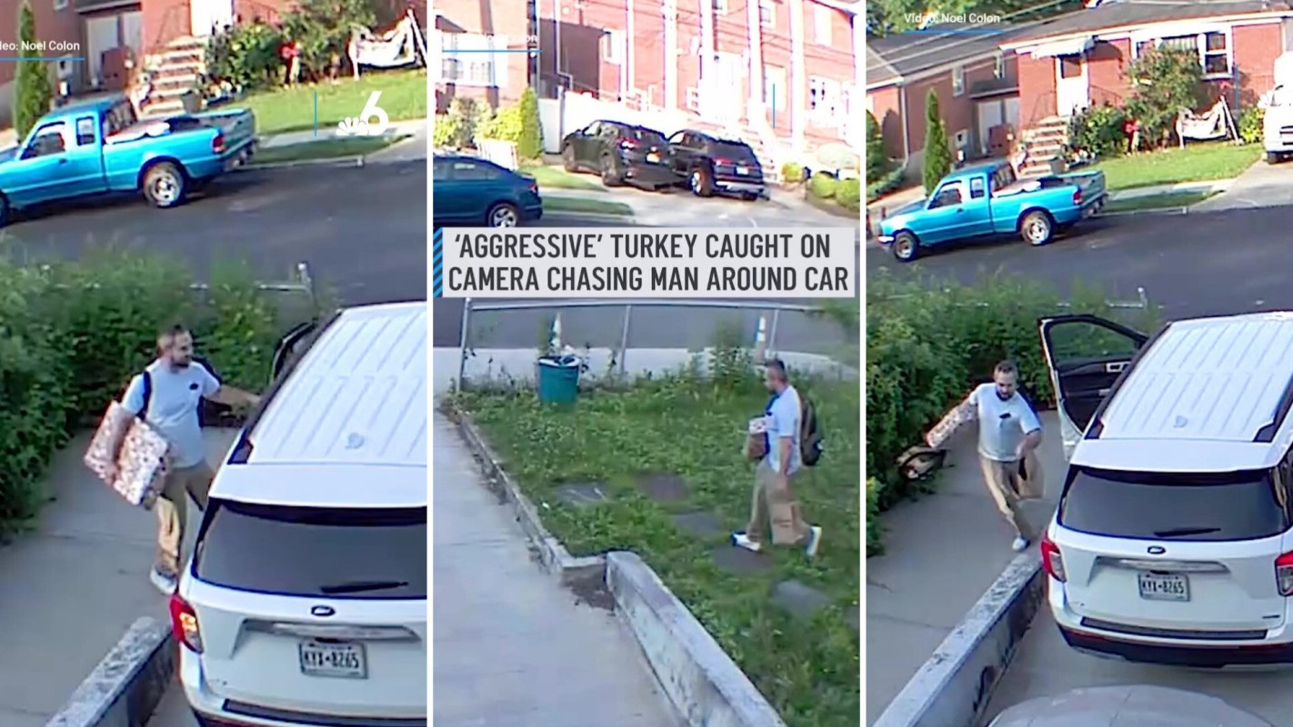 In the video, the man is seen holding handfuls of his belongings as he tries to enter his car.