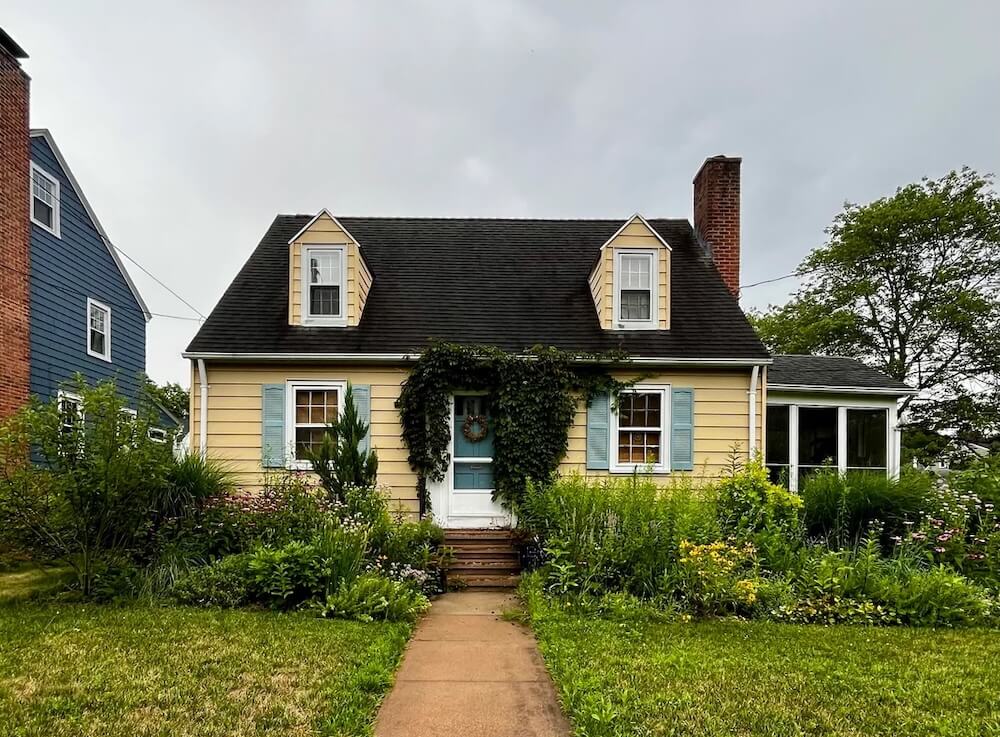 Generous garden beds overflow with hundreds of lush plants.