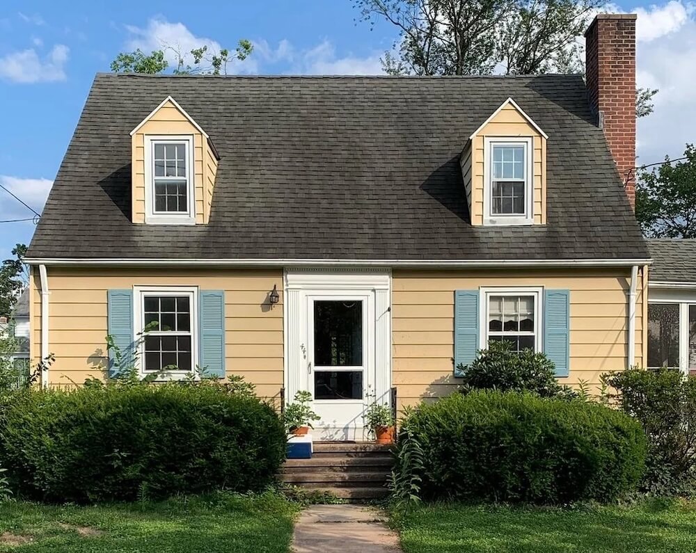 Generous garden beds overflow with hundreds of lush plants.