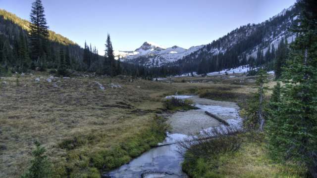 The land features miles of rivers, fish-filled creeks, native plants, and wildlife like elk, bears, and wild horses.