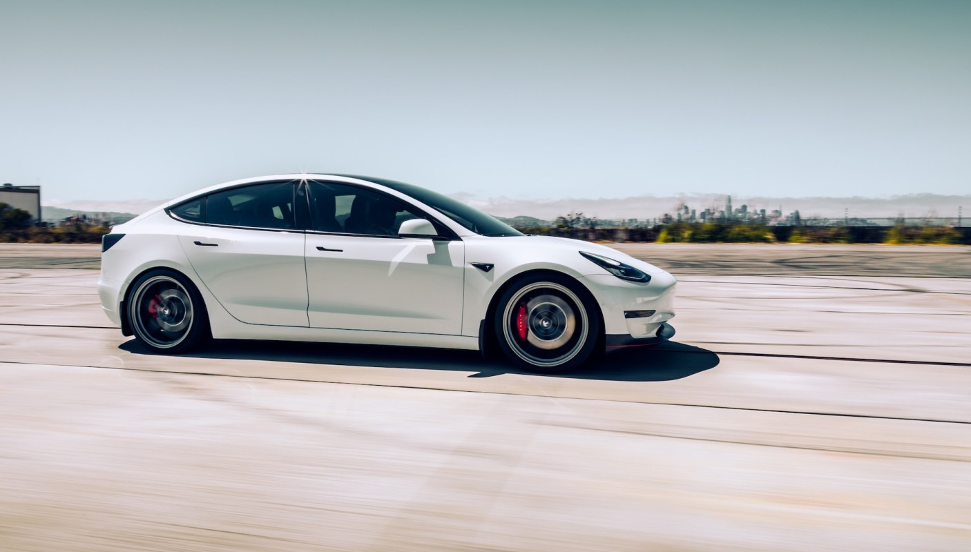 A Tesla driver barely escaped what could have been a horrific collision with a low-flying plane.