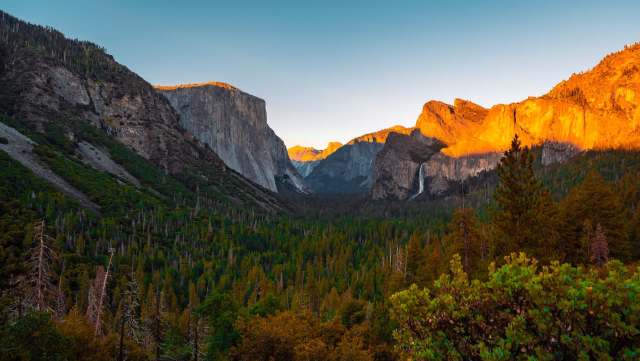 Rising temperatures are affecting how many people visit national parks like Yosemite — here's how.
