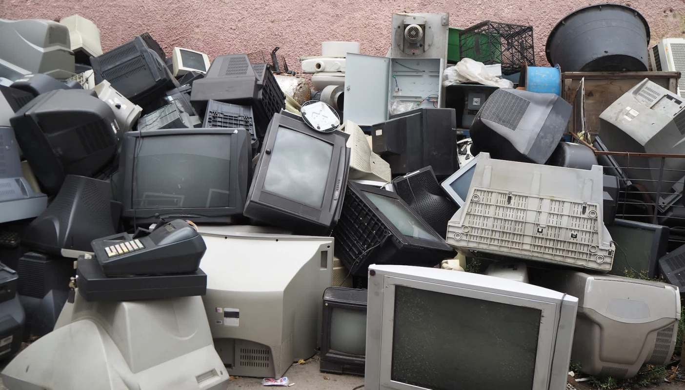 A pile of discarded televisions and computer monitors outside a rural Michigan home reached almost 20 feet before a fire destroyed the property.