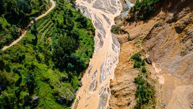 Flooding washed away several bridges and blocked roads.