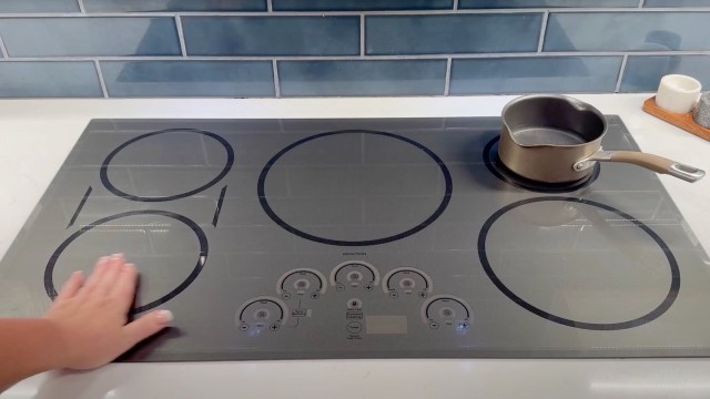 The model the chef showed has a stainless steel top with five burners.