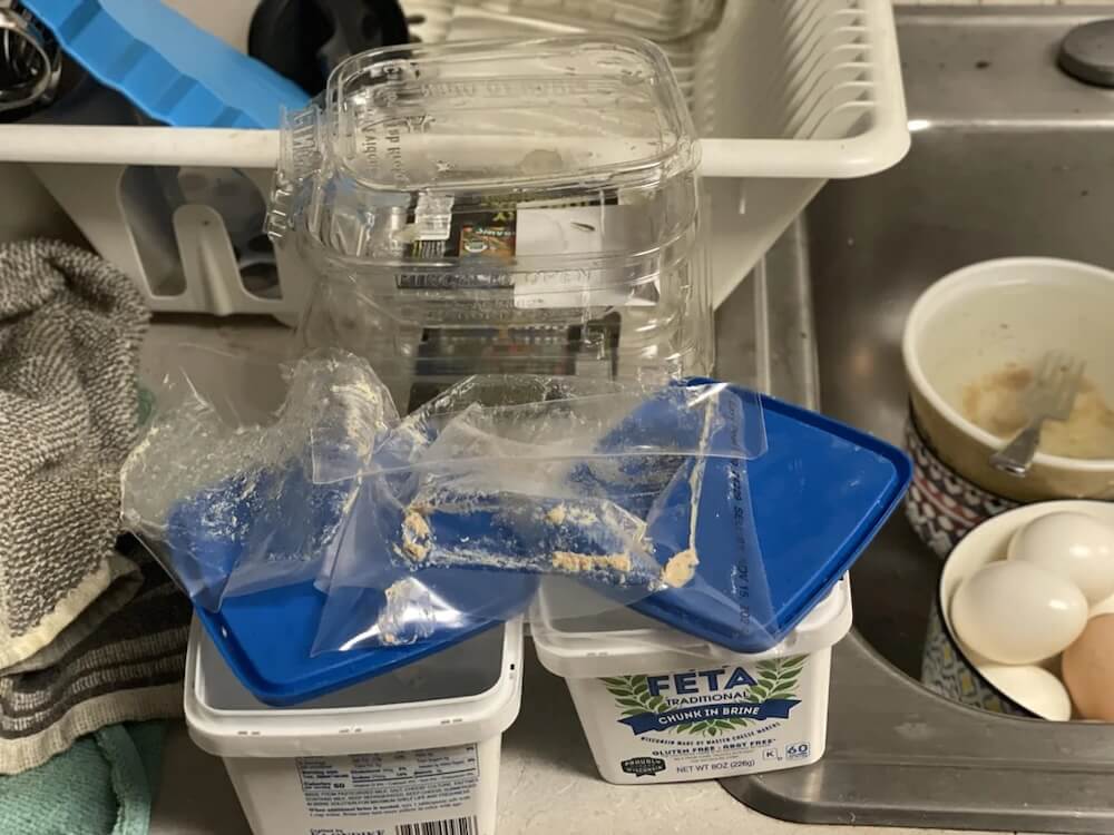 A user posted, highlighting the sheer amount of plastic packaging from their groceries, with the title, "And I can't get a plastic bag because it's bad for the environment."