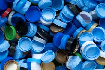 Save money and help the environment by making this simple, free cat toy out of old water bottle caps.