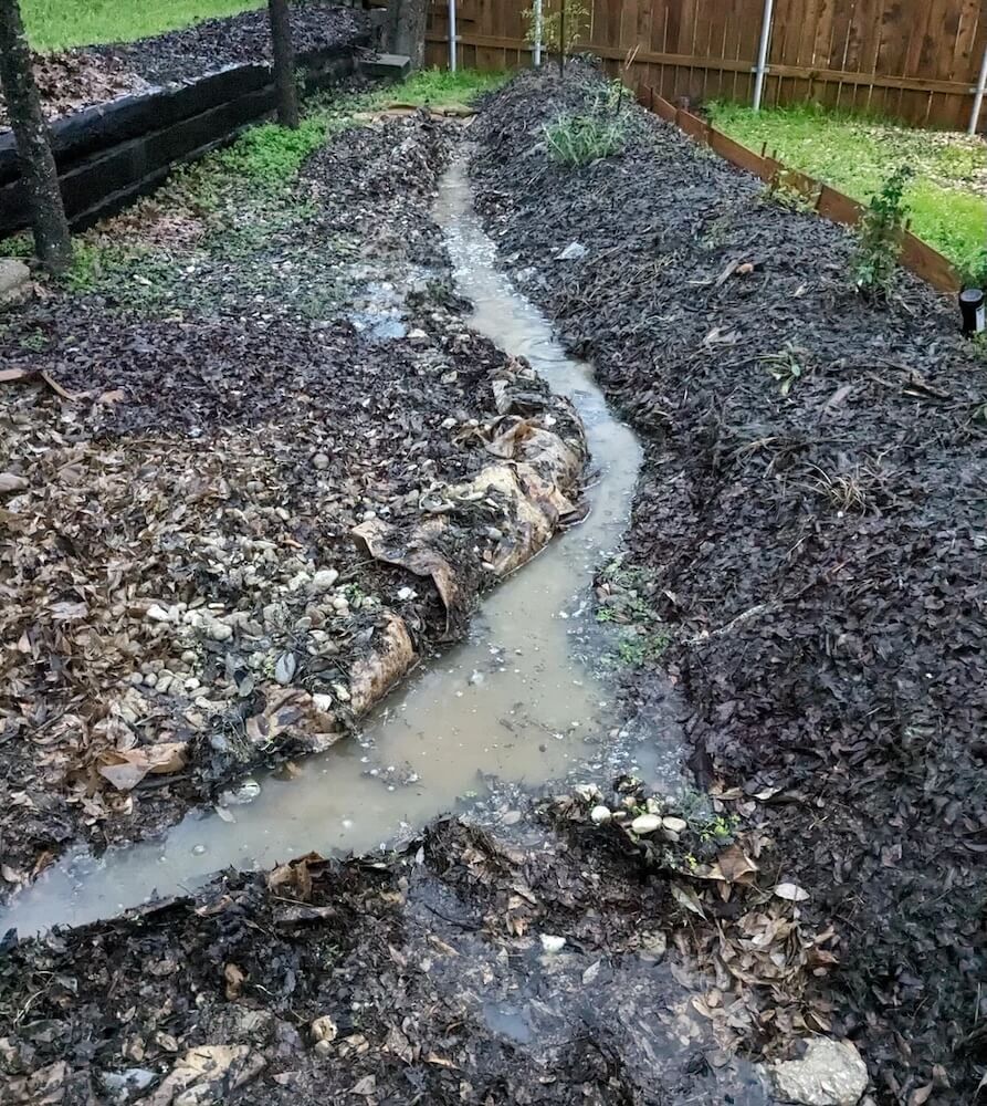 Land sculpting, as showcased in one Redditor's before-and-after photos, is a useful way to help prevent yard flooding.
