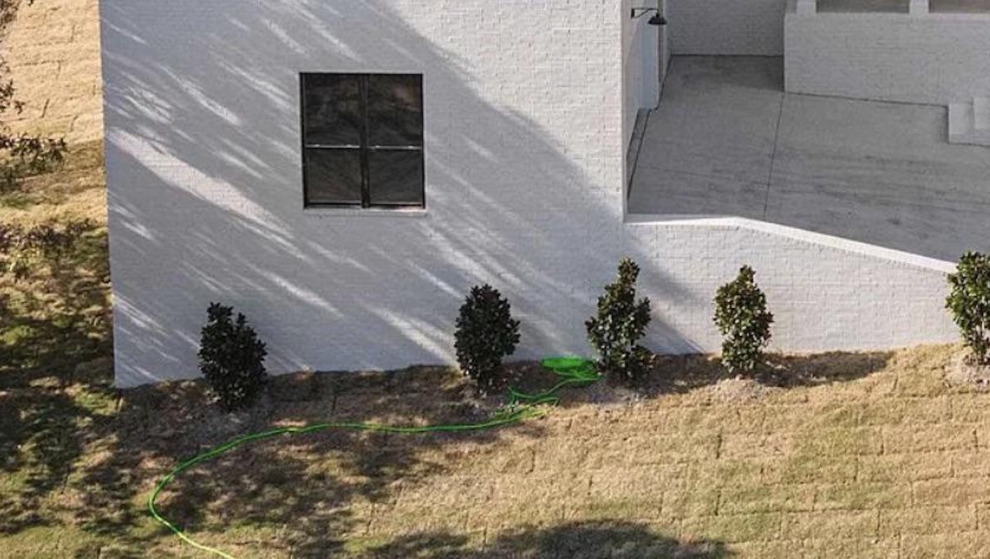 A photo of a large lakeside "McMansion," shared by a Redditor, has set off quite the debate in an online community.