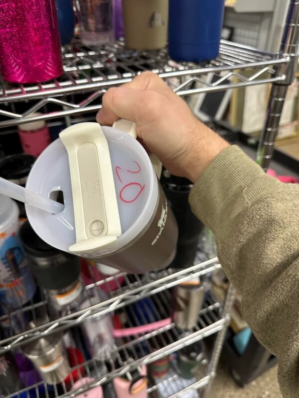 One thrifter shared their frustrating experience finding an overpriced Stanley water bottle at a thrift shop.