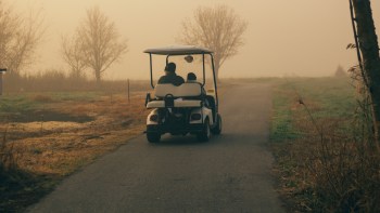 A viral video shows a bull elk on a golf course in Estes Park, Colorado, chasing after a speeding golf cart.