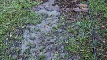 Land sculpting, as showcased in one Redditor's before-and-after photos, is a useful way to help prevent yard flooding.