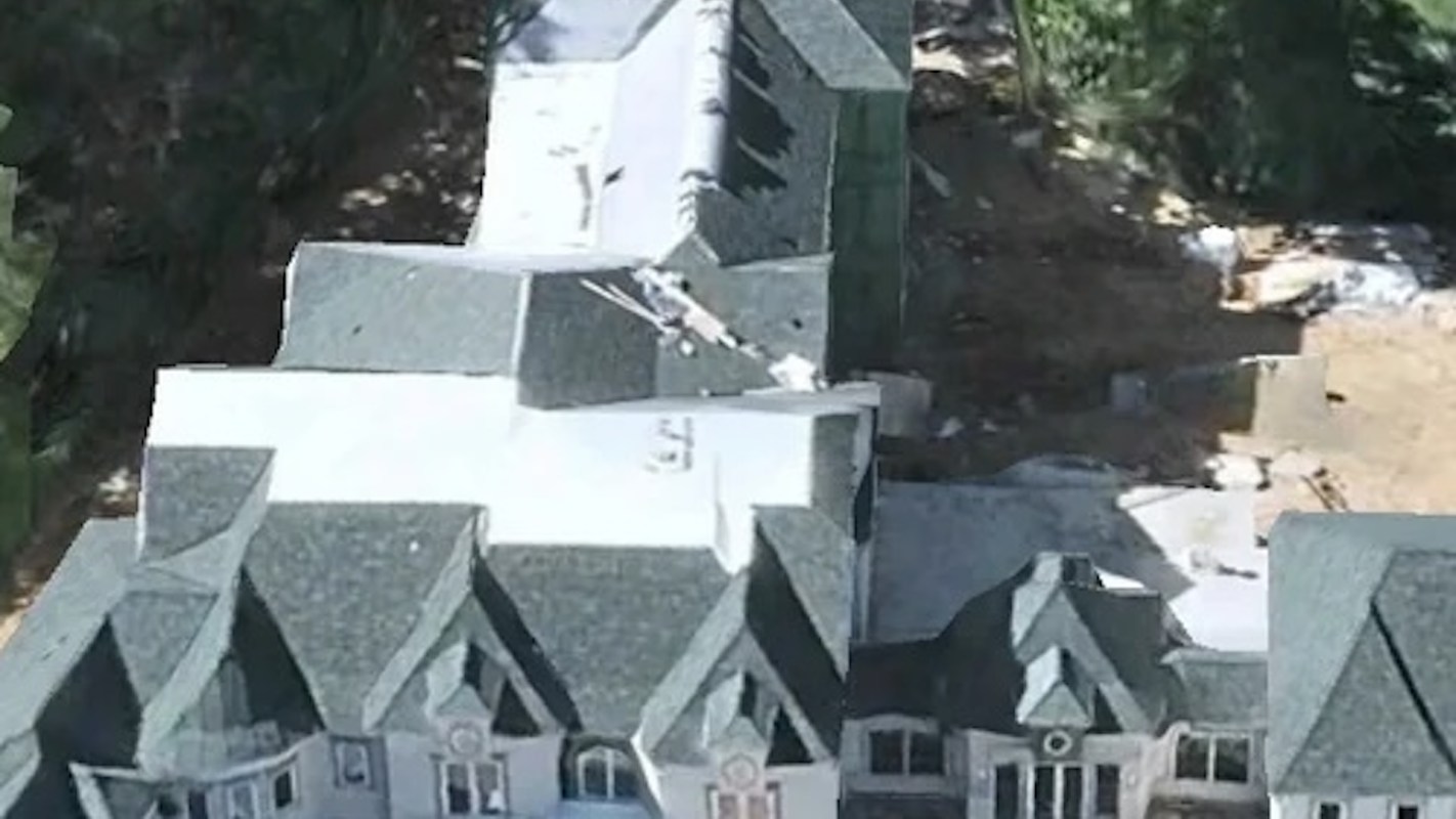 One person was so awestruck by a particularly monstrous McMansion that they couldn't help but snap a few photos of it.