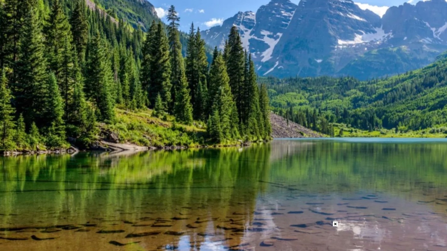 A Redditor shared a photo of a group of people at the Maroon Bells who were disregarding barriers and revegetation signs.
