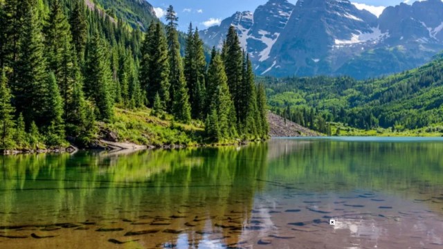 A Redditor shared a photo of a group of people at the Maroon Bells who were disregarding barriers and revegetation signs.