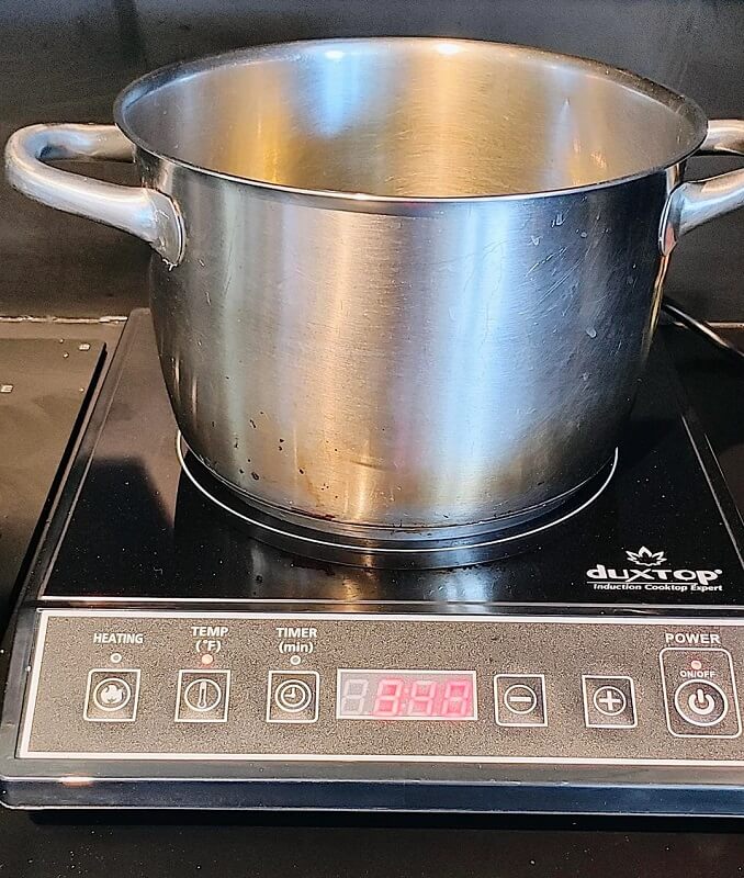 An induction cooktop is a clean-energy cooking method that directly heats cookware on a stove using an electromagnetic field.