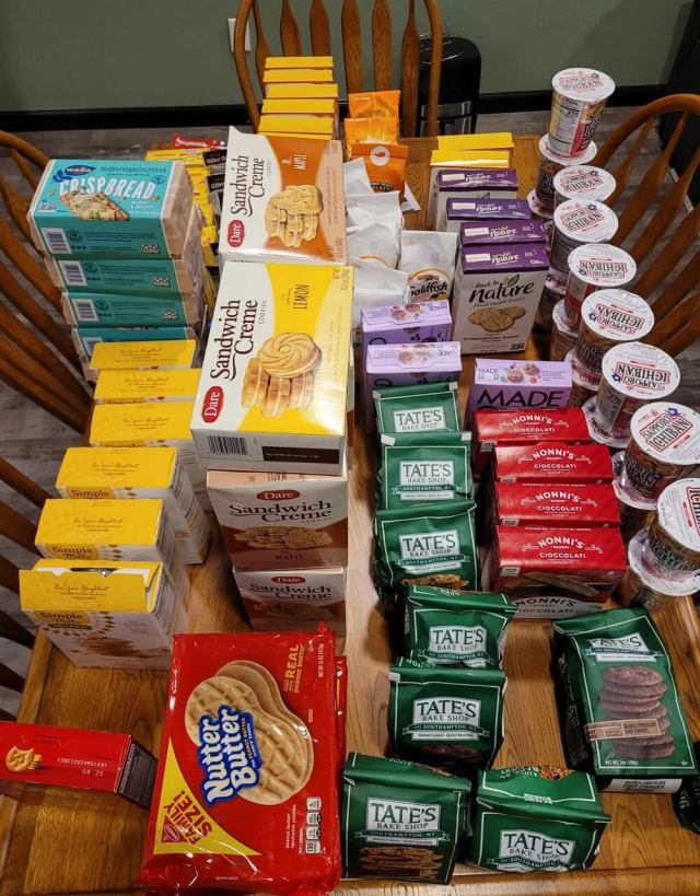 A Redditor shared photos of their largest dumpster diving haul yet, with dozens of packaged food items and recalled candles rescued from the trash.