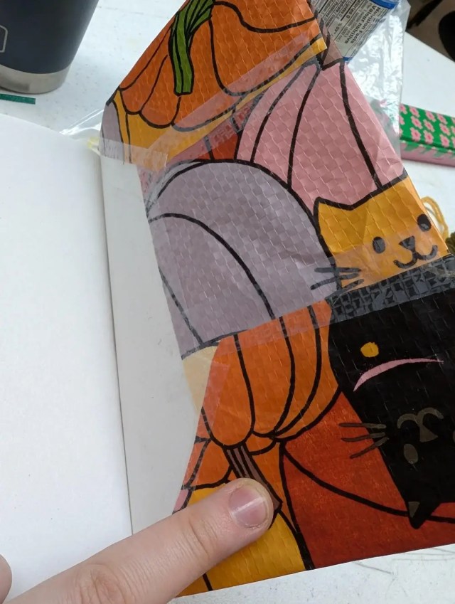 One Redditor discovered a clever and elegant solution to avoid paying for a book cover — by upcycling a grocery bag.