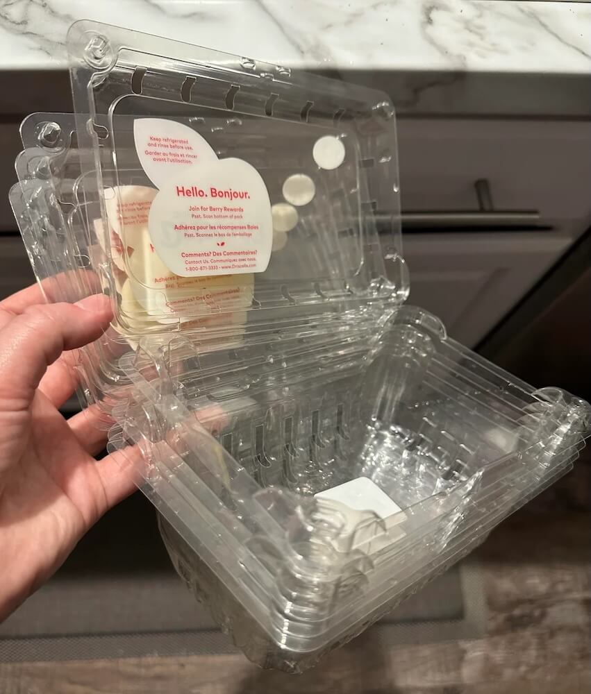 Instead of tossing your plastic produce containers, here's a clever way to give them new life — and share your homegrown harvests with neighbors.