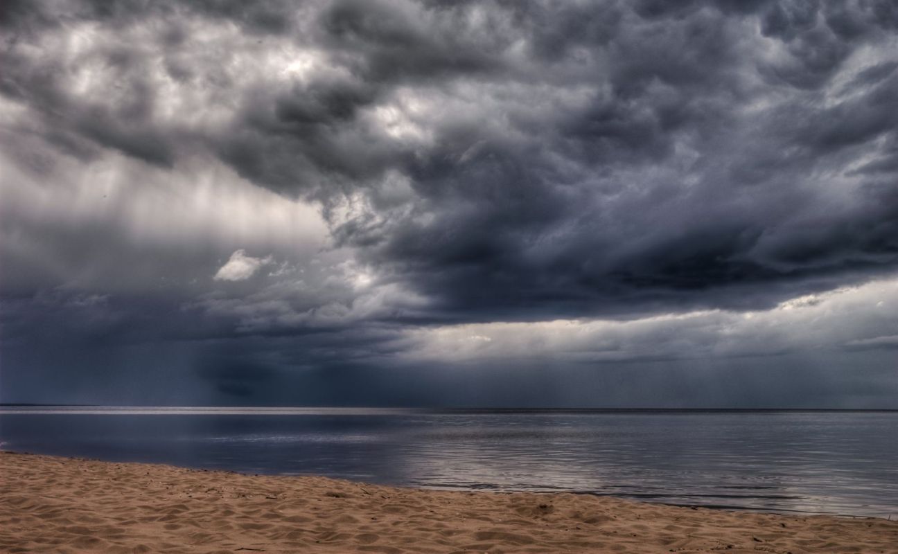 A floating billboard disrupted a sunny day at the beach when it appeared just offshore, drifting near swimmers.