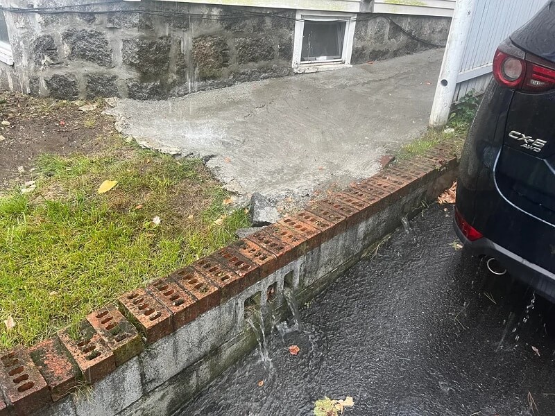 One Massachusetts resident is dealing with the fallout from their neighbor's poor DIY drainage fix.