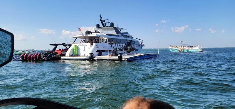 Reddit users were shocked by audacious images of a luxury yacht connected to three additional boats and a helipad.