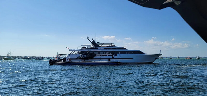 Reddit users were shocked by audacious images of a luxury yacht connected to three additional boats and a helipad.