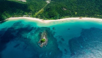 The residents of the central Filipino island of Batasan are dealing with land subsidence and are spending much of their time in knee-deep water.