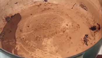 One TikToker demonstrated how to clean a heavily soiled Dutch oven pan with nothing more than baking soda and boiling water.