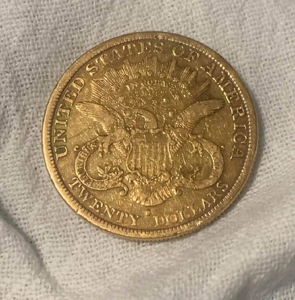 A curious thrifter was in for a surprise when they posted a photo of a gold double eagle coin from 1877 they'd found in a Goodwill jewelry box.