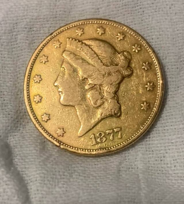 A curious thrifter was in for a surprise when they posted a photo of a gold double eagle coin from 1877 they'd found in a Goodwill jewelry box.
