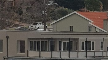 One person captured attention online with an image of a boxy home in Melbourne, Australia, with a balcony held up by unappealing columns.