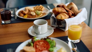 Coffee prices are surging in the U.S. due to trade deals and extreme weather, leaving Americans paying more for their morning brew.