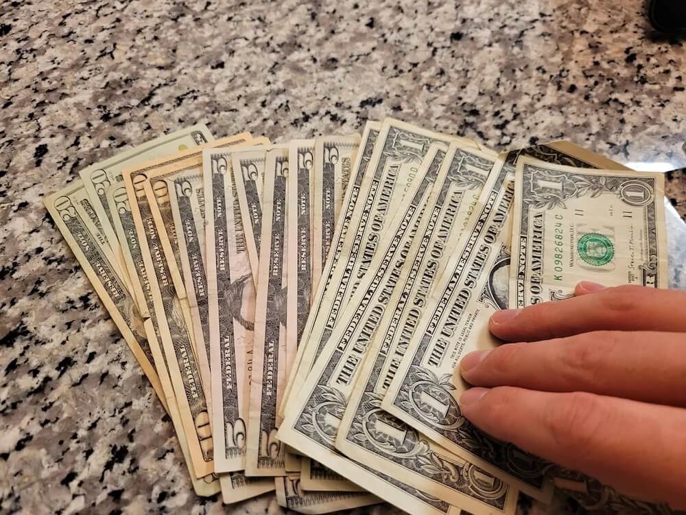 One Redditor's girlfriend got lucky and found $143 in cash hidden inside a thrifted motorcycle cigarette case.