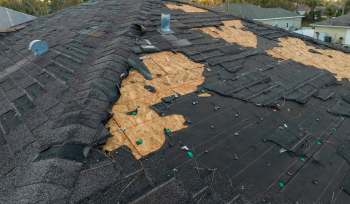 Roofing USA's owner, Andrew Shick, was amazed but also concerned when he encountered record-setting hailstones that damaged metal roofing in an Illinois community.