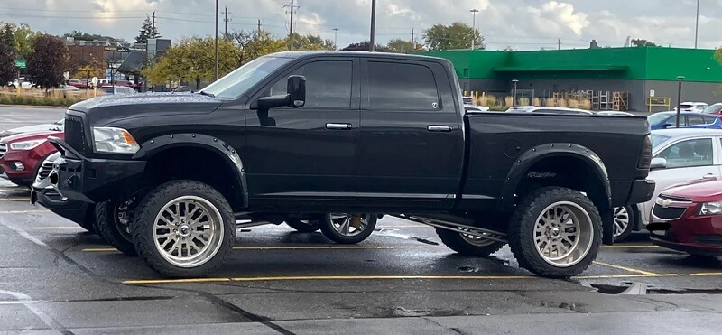 One Redditor shared a photo of a massively lifted Dodge Ram truck and called it a compensator.