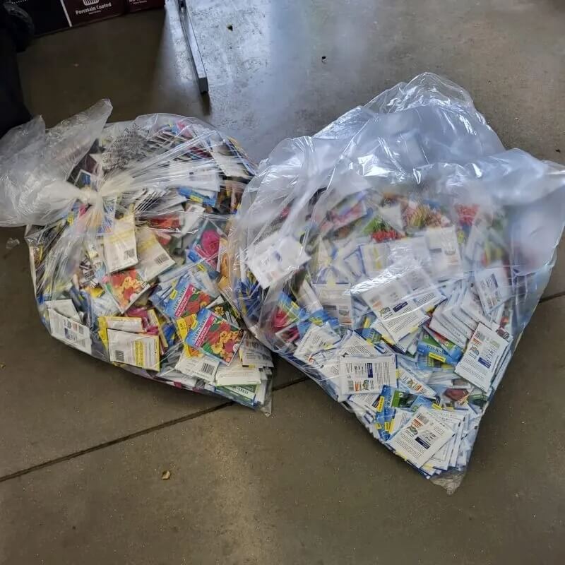 A Walmart employee sparked a heated conversation about corporate waste after sharing a photo of hundreds of seed packets destined for the trash.