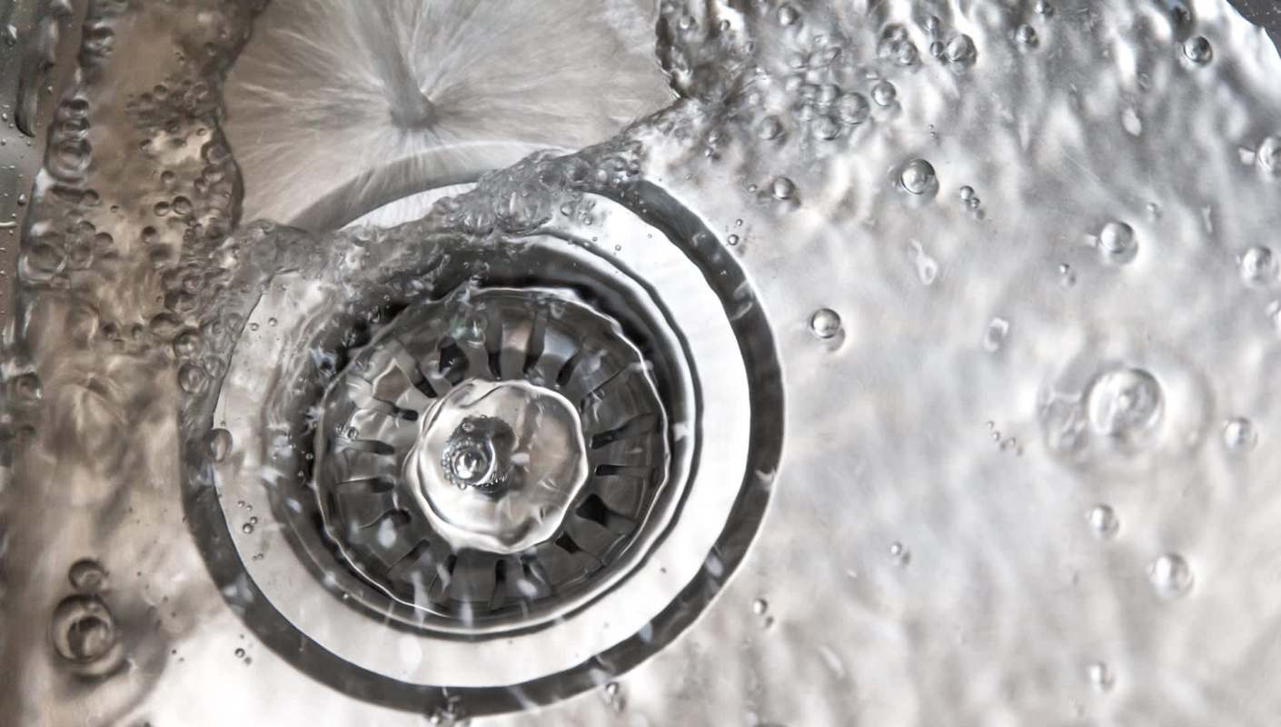 One TikTok user explains how to unclog a kitchen sink with just hot water and soap.